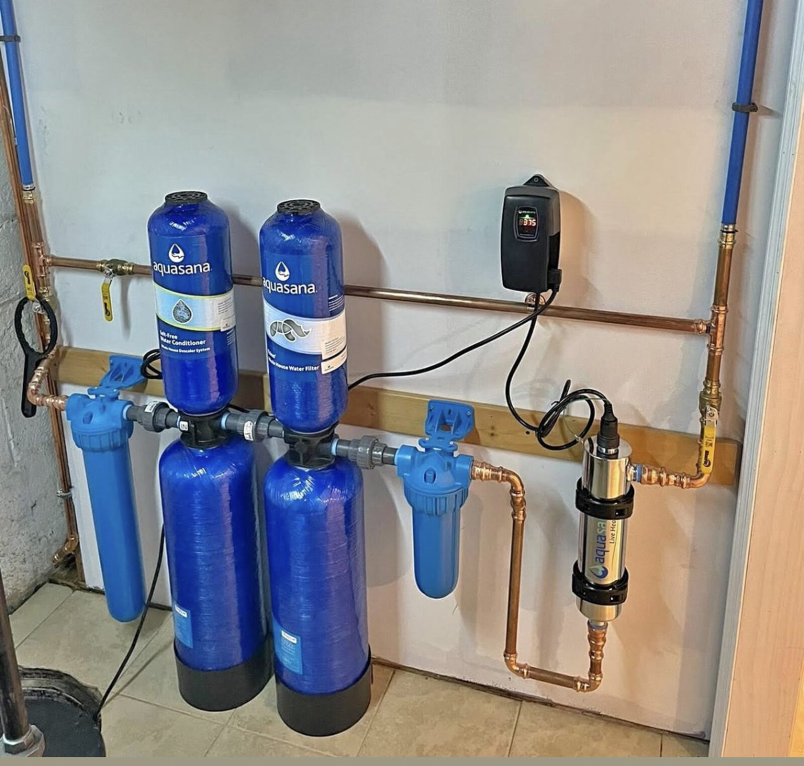 Aquasana whole house water filter and salt-free conditioner with UV sterilizer plumbed into copper main lines